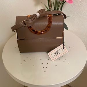 Handbag with shoulder strap